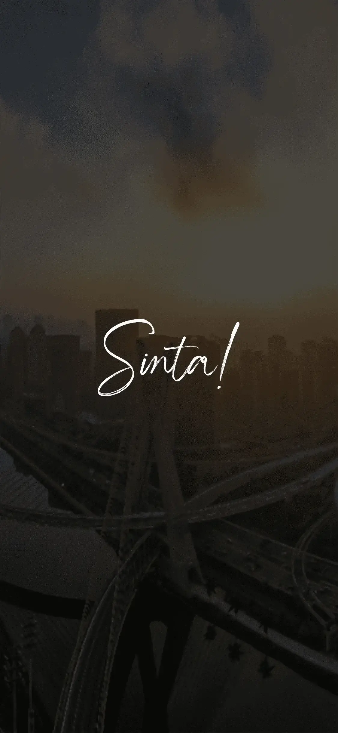 City of São Paulo-SP with emphasis on the sunset and the Octávio Frias de Oliveira cable-stayed bridge over the Tietê River, in the background there are buildings and avenues with the text 'Feel!'.
