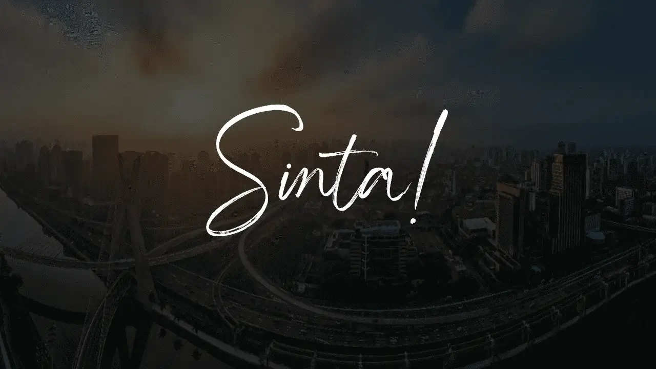 City of São Paulo-SP with emphasis on the sunset and the Octávio Frias de Oliveira cable-stayed bridge over the Tietê River, in the background there are buildings and avenues with the text 'Feel!'.
